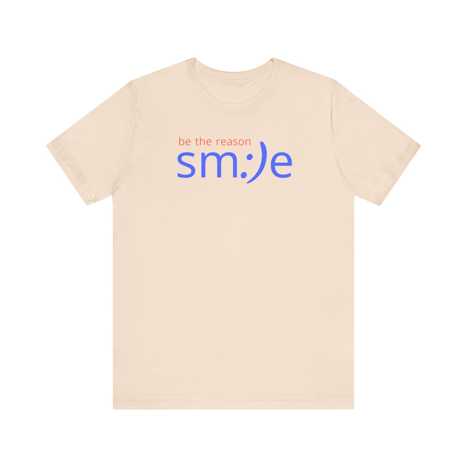 Beige t-shirt with 'be the reason smile' text on a white background