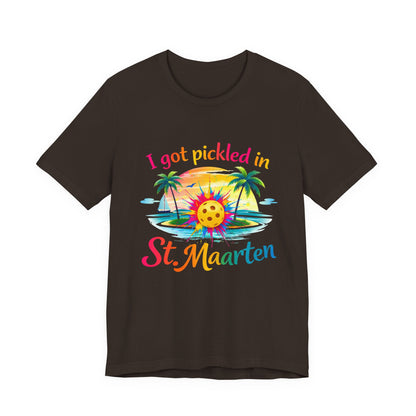 Black t-shirt with colorful graphic and text 'I got pickled in St Maarten' on a white background