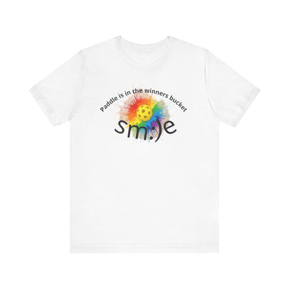 White t-shirt with colorful smiley face design and text on a white background