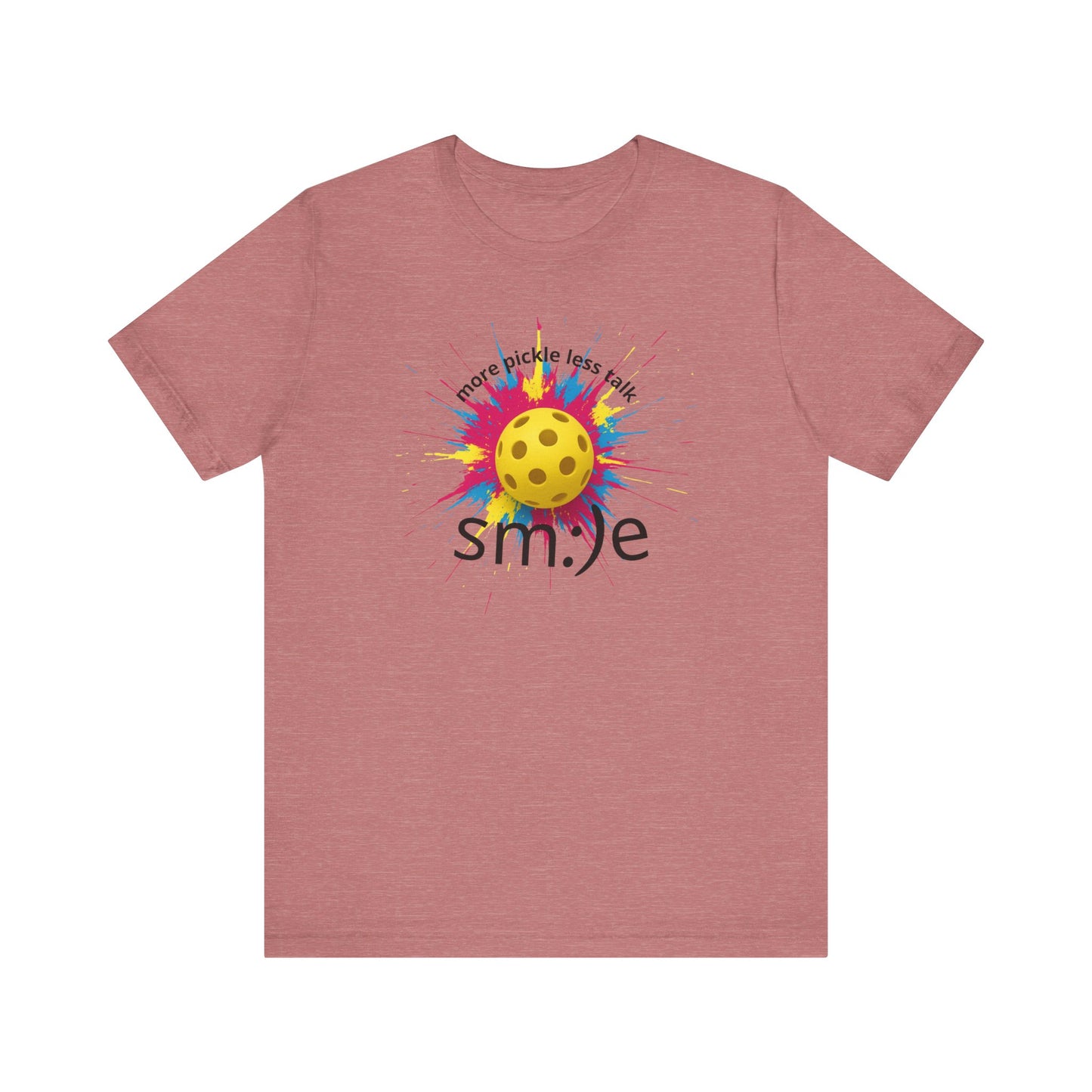Pink t-shirt with a colorful pickleball design and 'smile' text on a white background