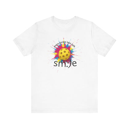 White t-shirt with colorful pickleball design and 'smile' text on a white background