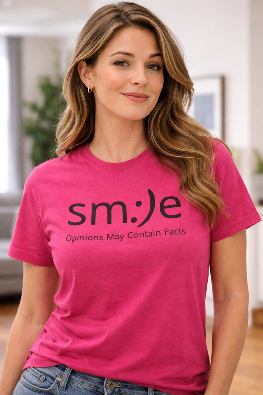Woman wearing a pink t-shirt with 'smile: Opinions May Contain Facts' text.